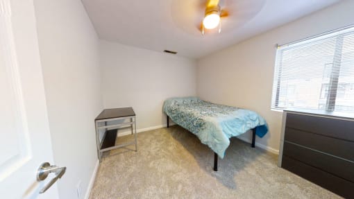 a bedroom with a bed and a nightstand