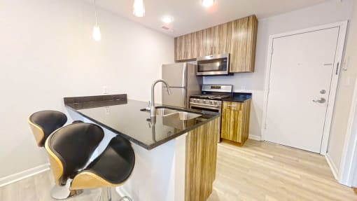 a kitchen with a counter top and a stove top oven