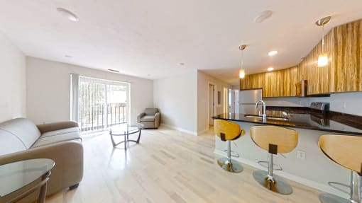 a kitchen and living room in a 555 waverly unit