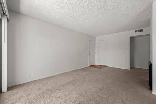 our spacious living room is empty and ready for you to move in
