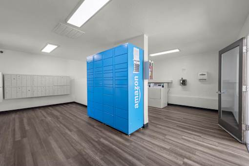 a blue vending machine is in the middle of a room
