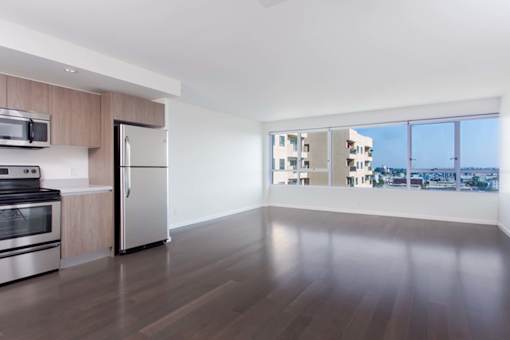 A modern kitchen with a refrigerator, oven, and microwave. at The View, Los Angeles, CA