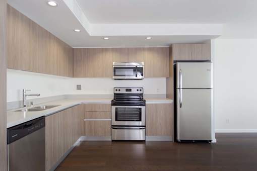 A modern kitchen with a stainless steel refrigerator and oven. at The View, California, 90005