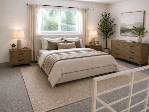 A bedroom with a large bed, nightstands, and a rug.
