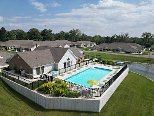 A large house with a pool in the backyard.
