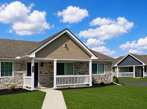 A house with a front porch and a white railing.