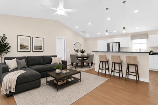 A living room with a grey sofa and a coffee table.