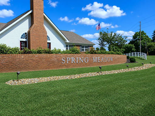 Spring Meadow sign in front of a house.