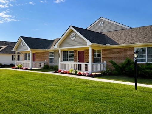 A house with a red door and white porch.