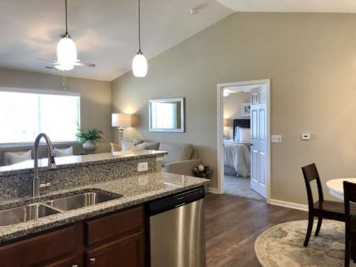 A kitchen with a sink and a dishwasher.