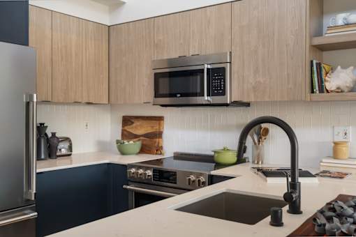 a kitchen with a sink and a stove