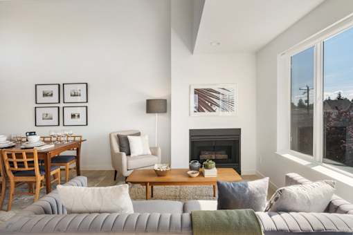 a view of the living room and dining area in a 555 waverly unit