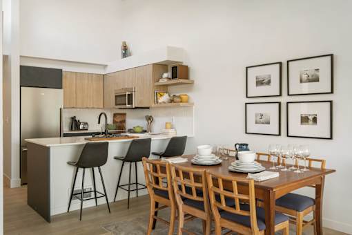 a kitchen and dining area in a 555 waverly unit