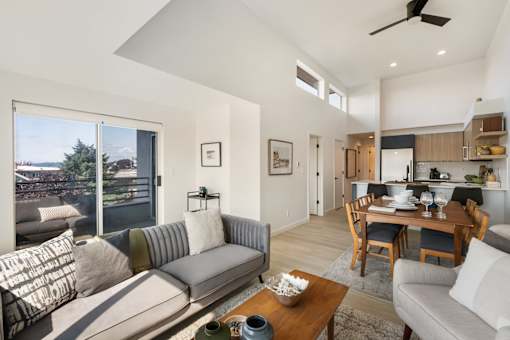 a living room with a couch a table and a chair
