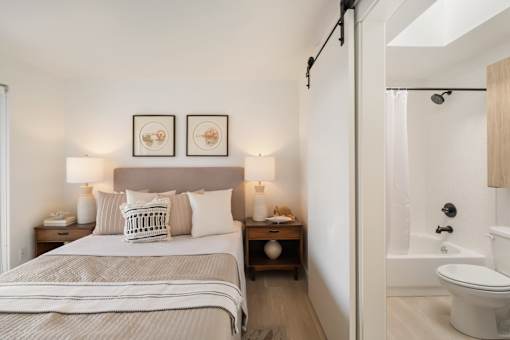 a bedroom with a bed and two night stands