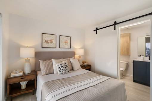 a bedroom with a bed and two night stands