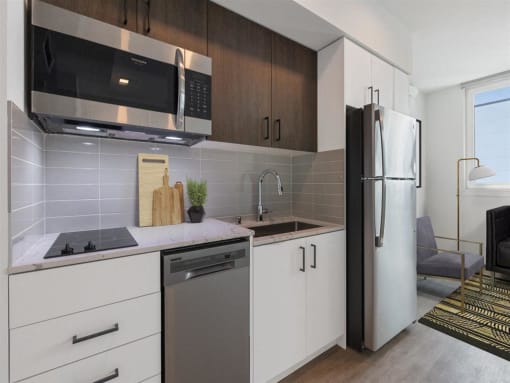 a kitchen with a sink and a refrigerator
