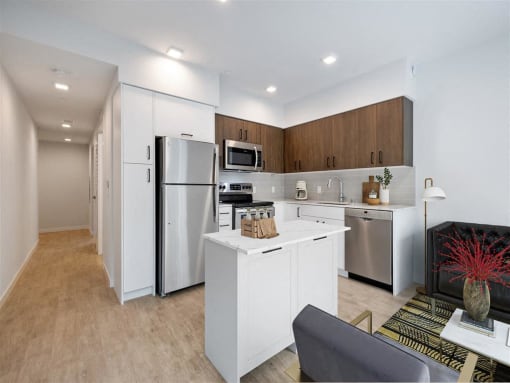 a kitchen with a counter top and a refrigerator