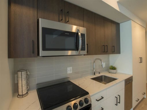 a kitchen with a stove and a microwave