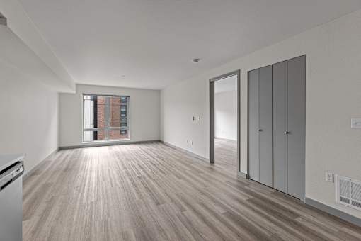 A room with wooden floors and white walls.