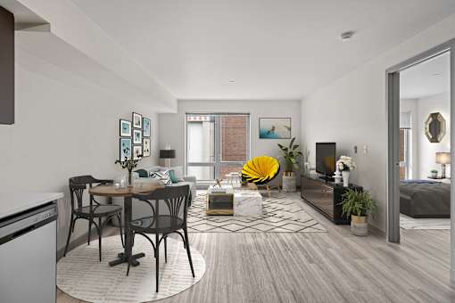 A modern living room with a dining table and chairs.