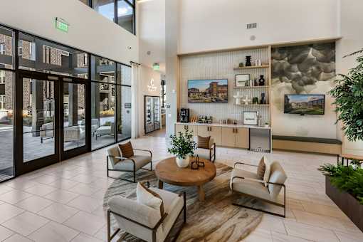 A modern living room with a glass door entrance.