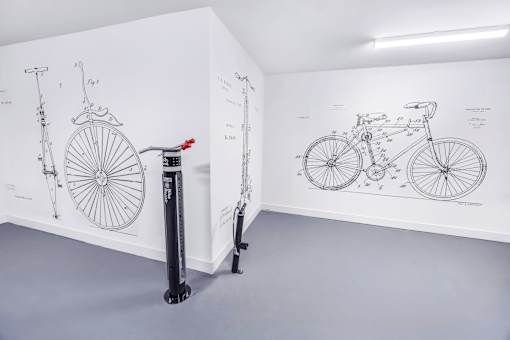 A bicycle is shown in a diagram on the wall.
