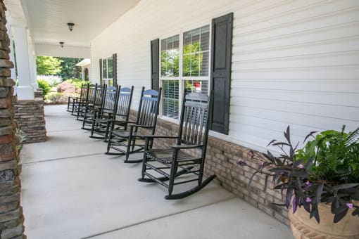 front porch of clubhouse with rocking chairs