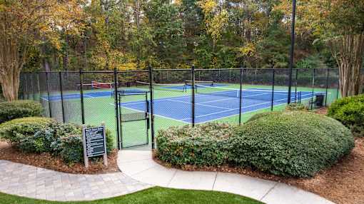 a tennis court with a fence around it