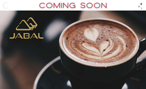 A cup of coffee with a heart design on top and the text