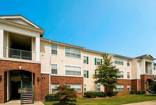 A large apartment building with a green lawn in front. at The Dawson Cartersville in Cartersville, GA 30191