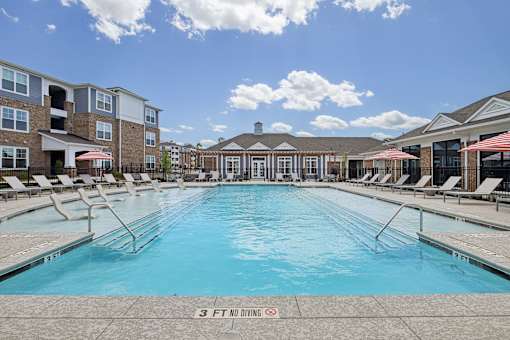 A large swimming pool with a 3 feet no diving sign.