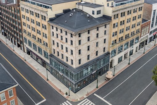 A street view of a city with buildings and a crosswalk.
