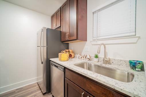 a kitchen with a sink and a refrigerator