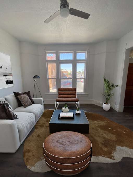 a living room with a white couch and a coffee table