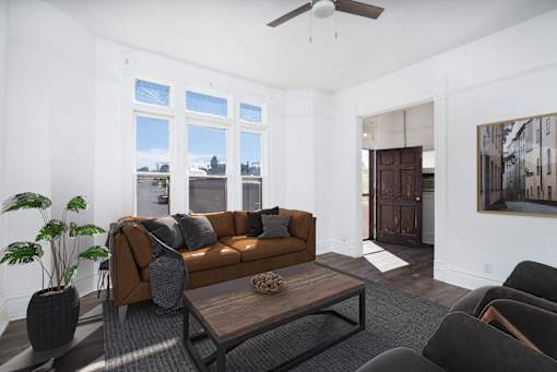 a living room with a brown couch and a coffee table
