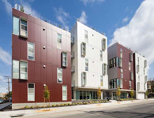 A modern building with a combination of red and white exterior.