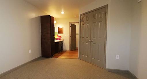 a hallway with a door and a counter in a room