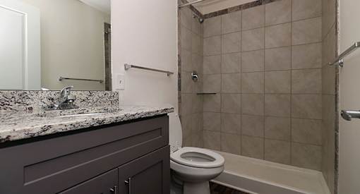 affordable section 8 stone mountain a bathroom with a toilet and a sink and a shower