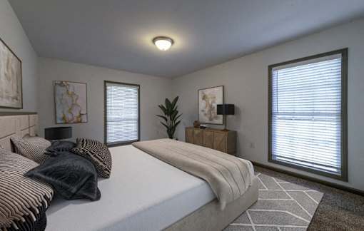 a bedroom with a bed and two windows