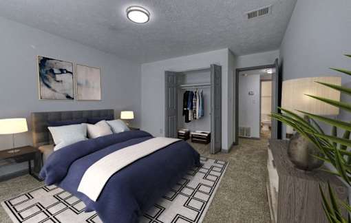 a bedroom with a blue and white bed and a bathroom