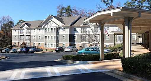 a building with many cars parked in front of it