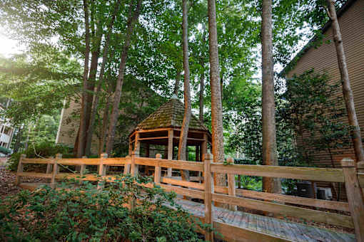 decatur luxury living a wooden bridge in the middle of a forest