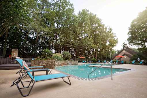 decatur luxury living resort style pool with chairs and a spa
