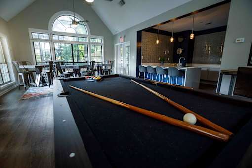 decatur luxury living a pool table is seen in the clubhouse of a building with a bar