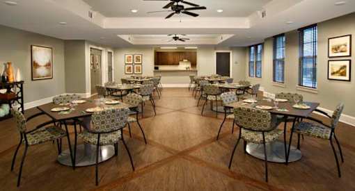 a large dining room with tables and chairs