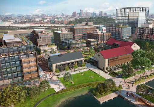 an aerial view of the university of memphis campus with the downtown memphis skyline in the