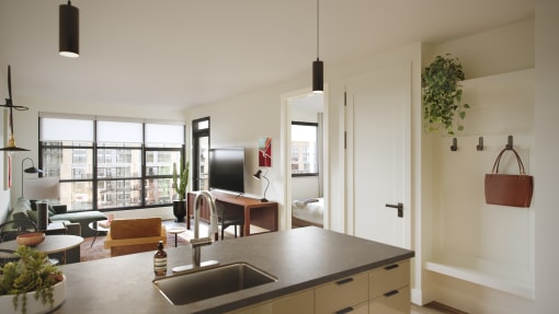 a view from the kitchen into the living room of a 555 waverly unit