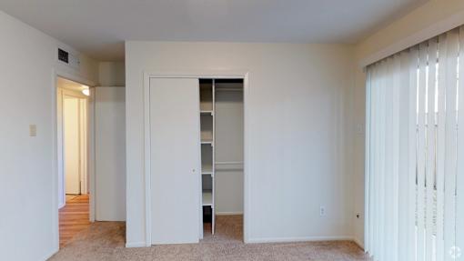 Bedroom with a closet at Cleary Pointe Apartments, Metairie