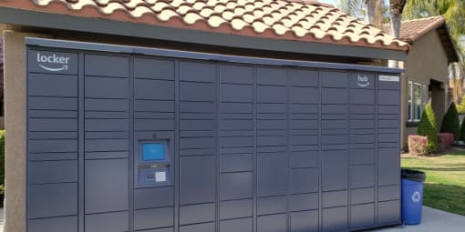 24 hour package lockers outside with ADA access control panel next to parking